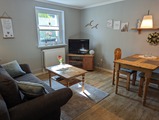 Ferienwohnung in K&uuml;hlungsborn - Thrun - Wohnzimmer mit Kochbereich