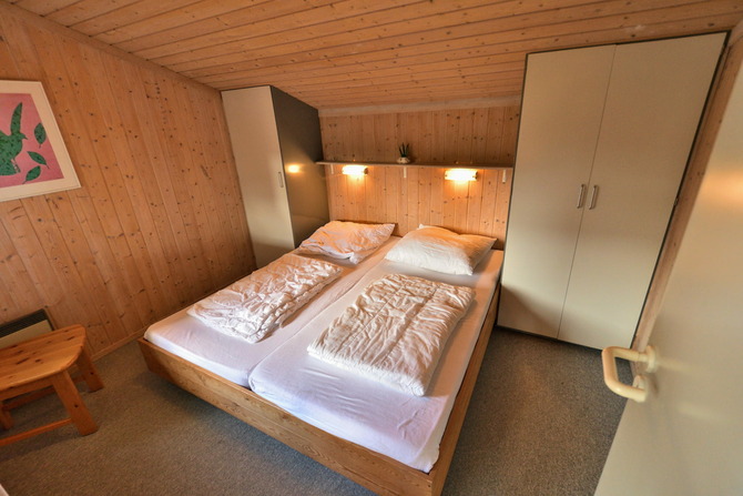 Ferienhaus in Pelzerhaken - Ferienhaus Typ A im Ferienpark AM WALDRAND - Schlafzimmer mit Doppelbett